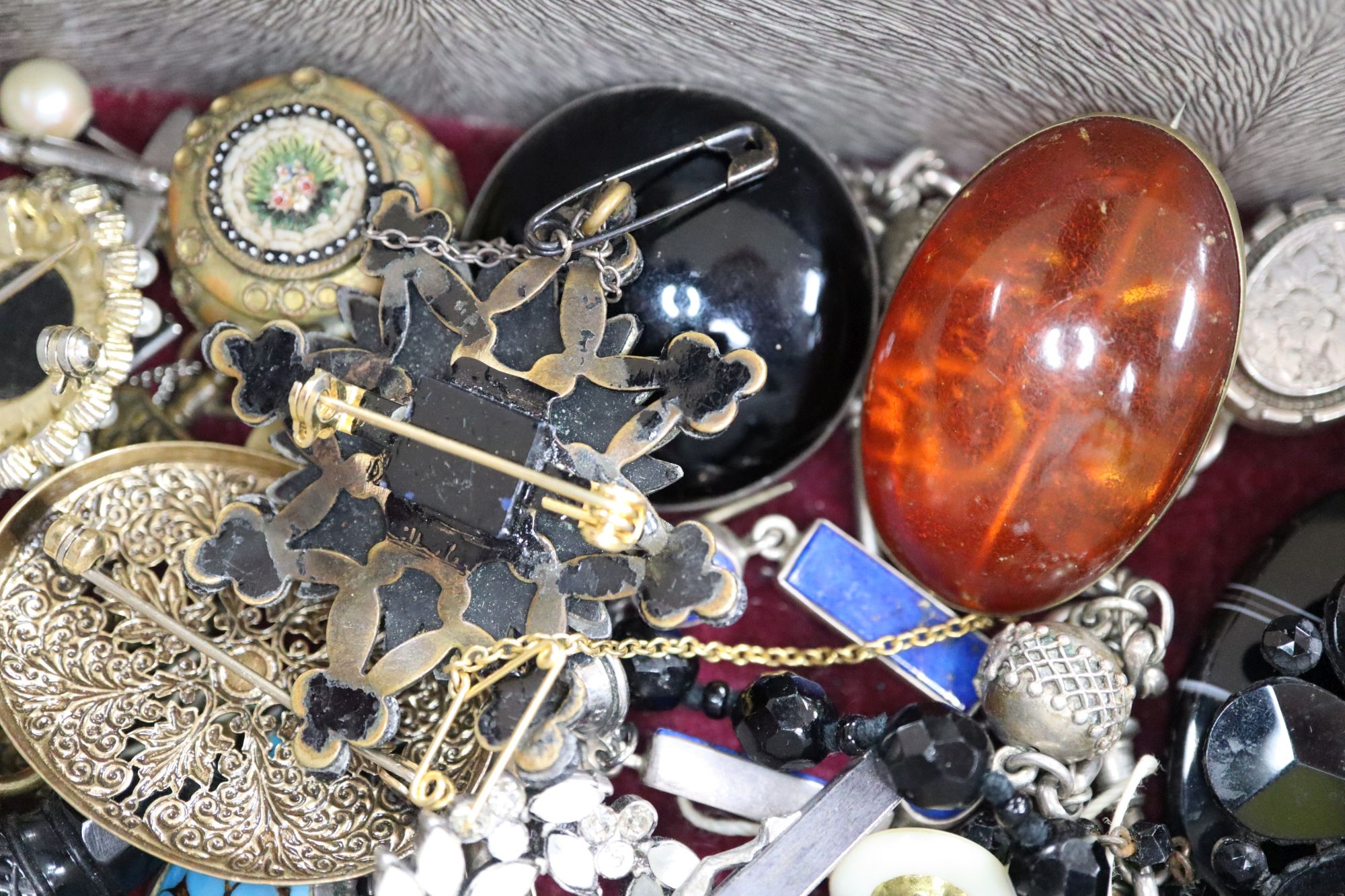 A small quantity of mixed jewellery, including a white metal locket on chain, a white metal and lapis lazuli bracelet, etc.